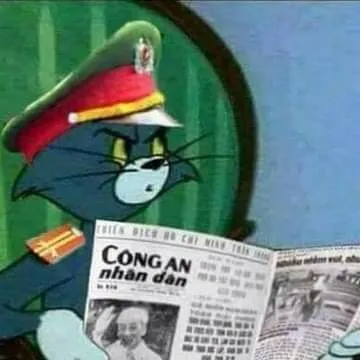 Mèo Tom đọc báo công an nhân dân