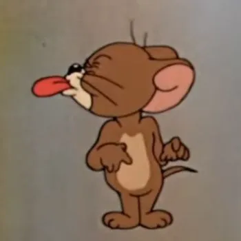 Jerry nghịch ngợm trêu Tom bằng nụ cười ngạo nghễ.