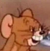 Jerry gương mặt thiểu năng, cười méo mó.