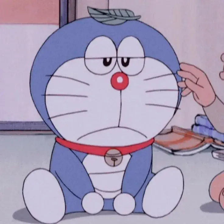 Ảnh mèo máy Doremon bất lực ánh nhìn bất lực buồn bã cực hài