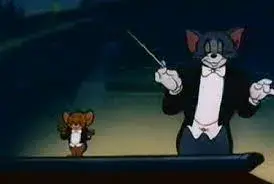 Hình mèo Tom khoác vest trông phong nhã, lịch sự.